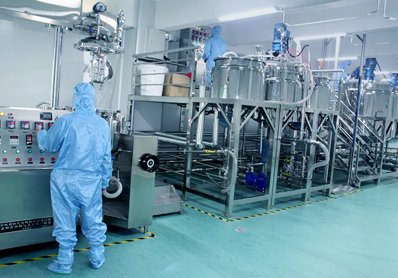 Aerial view of GMP-certified skincare production facility with automated lines